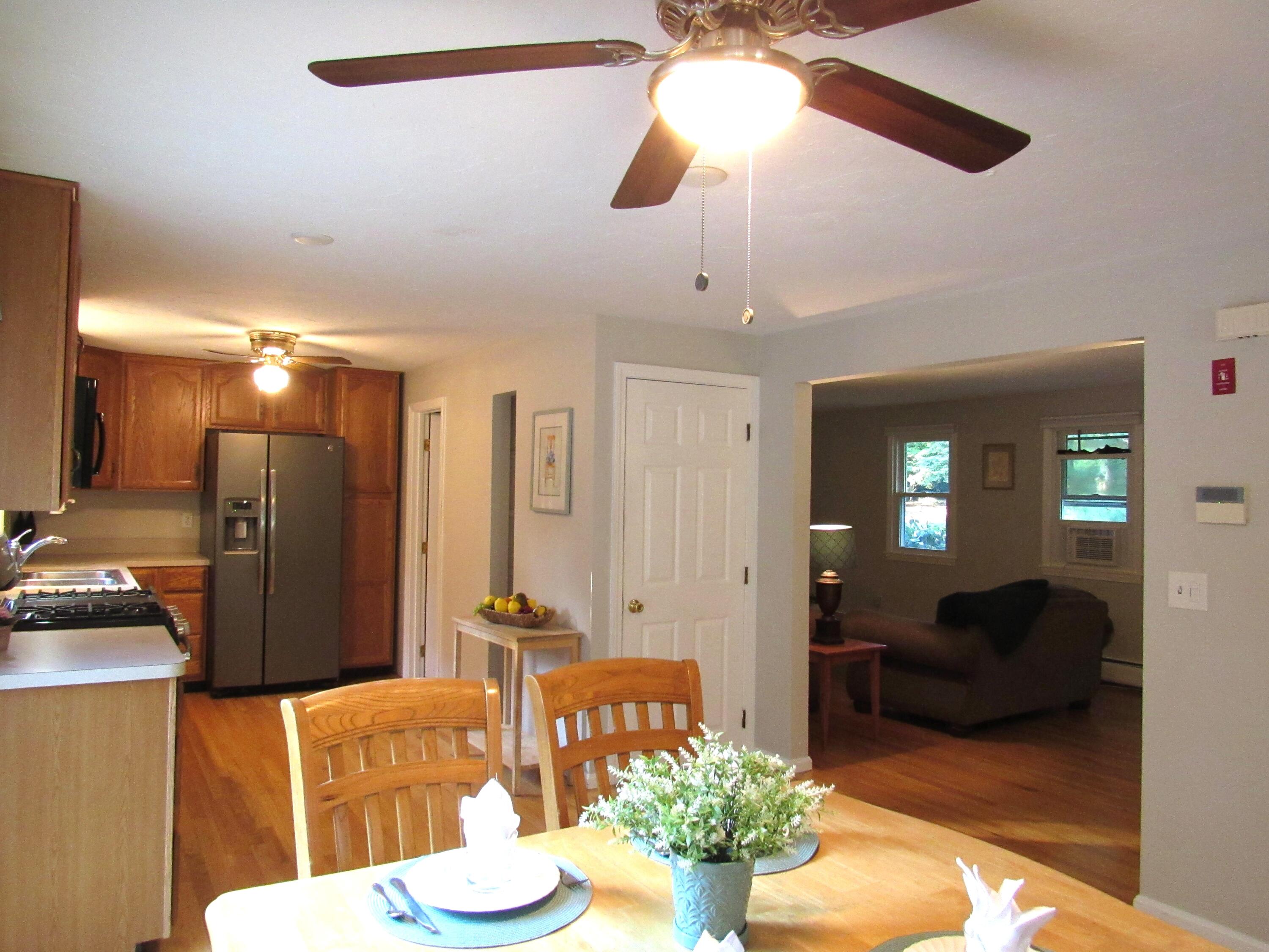 249 Ames Way Centerville, MA 02632 - Photo 12 of 41 a living room with furniture and a chandelier