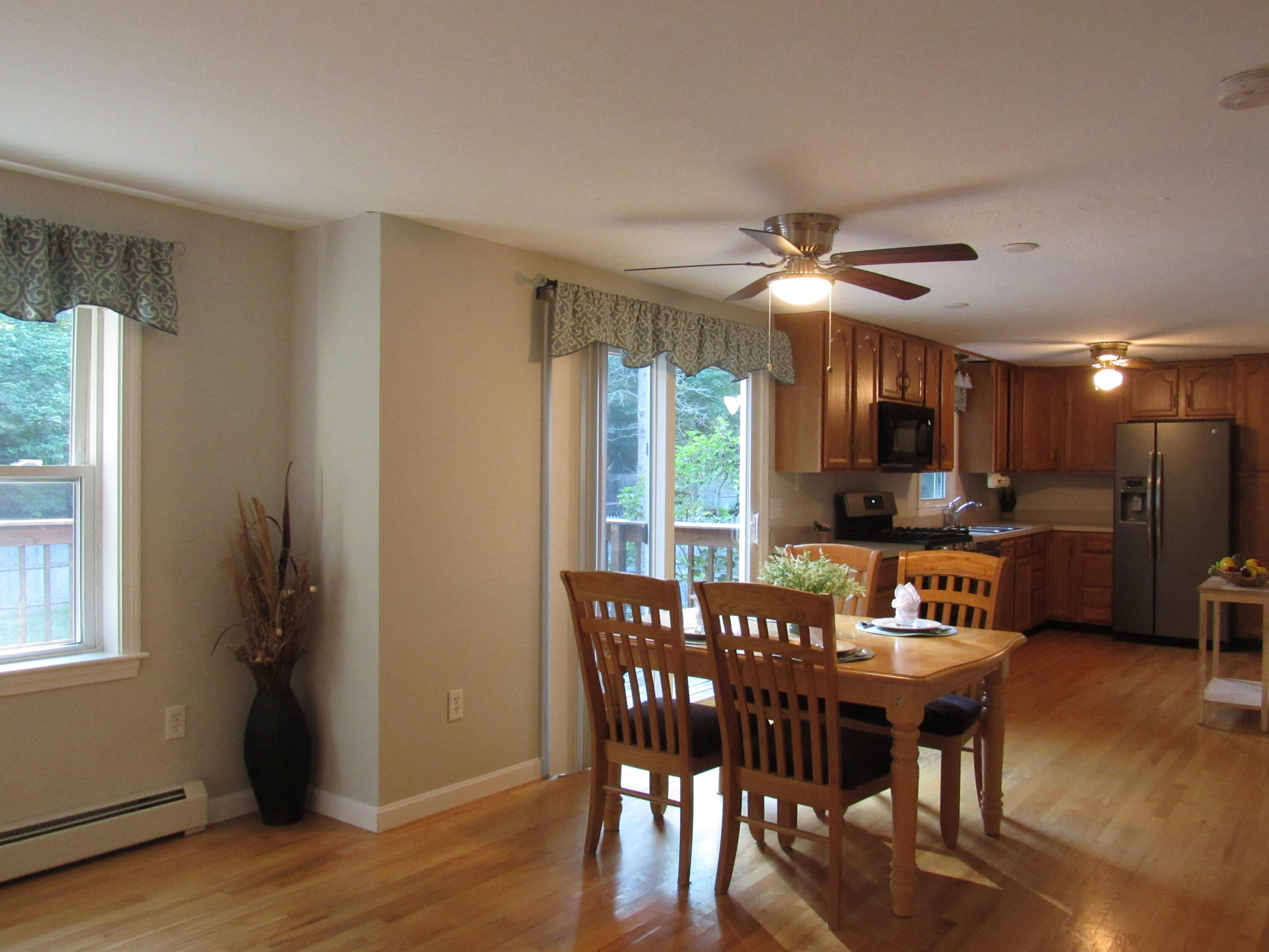 249 Ames Way Centerville, MA 02632 - Photo 13 of 41 a view of a dining room with furniture window and wooden floor