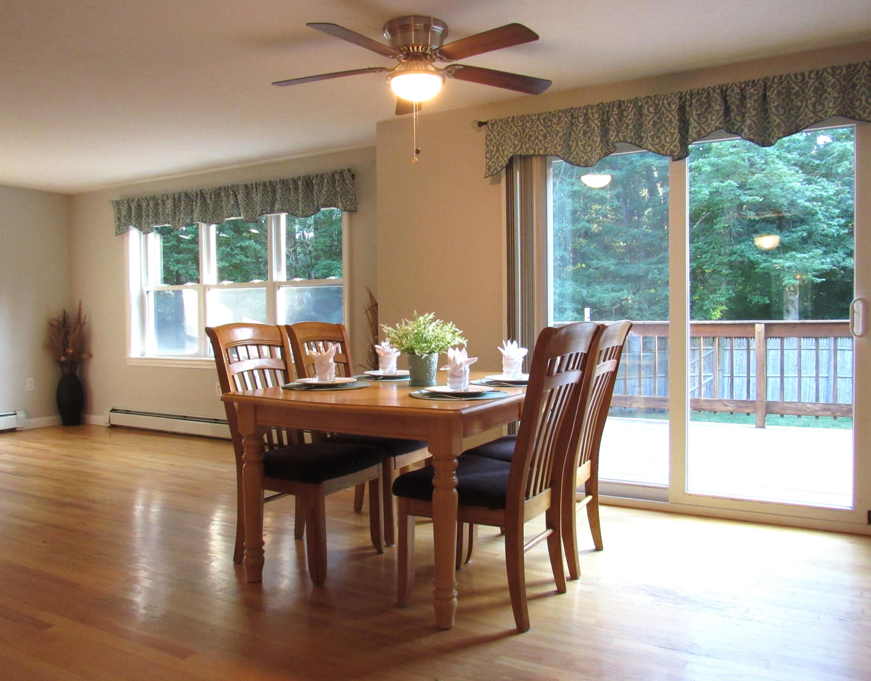 249 Ames Way Centerville, MA 02632 - Photo 14 of 41 a view of a dining room with furniture window and outside view