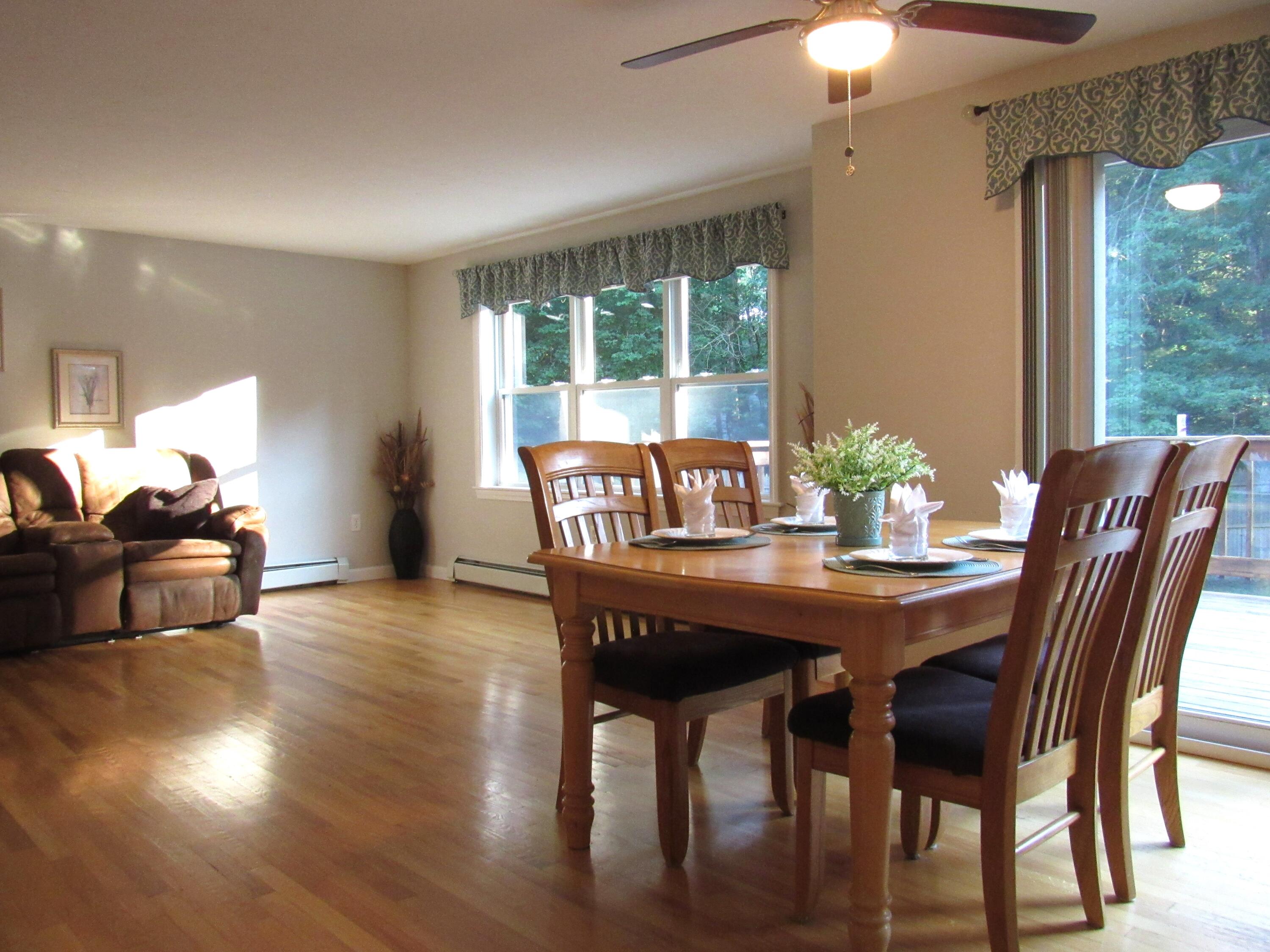 249 Ames Way Centerville, MA 02632 - Photo 15 of 41 a view of a dining room with furniture window and wooden floor