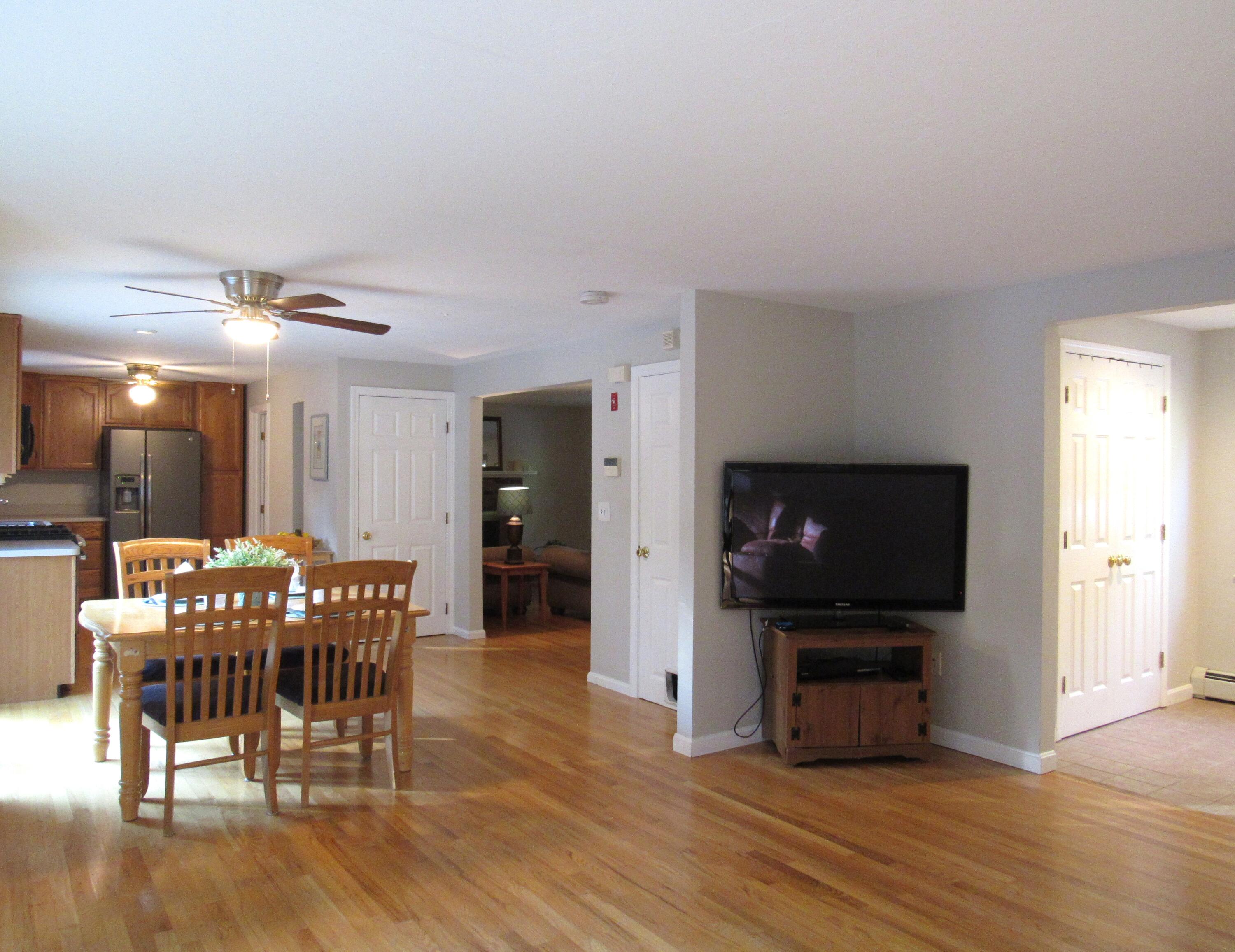 249 Ames Way Centerville, MA 02632 - Photo 16 of 41 a view of a dining room with furniture and wooden floor