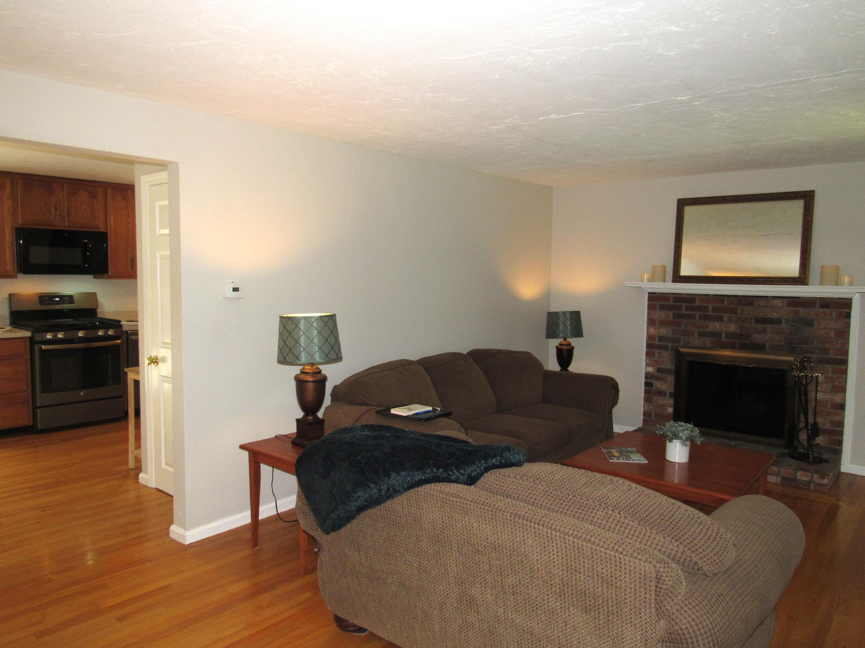 249 Ames Way Centerville, MA 02632 - Photo 21 of 41 a living room with furniture and a fireplace