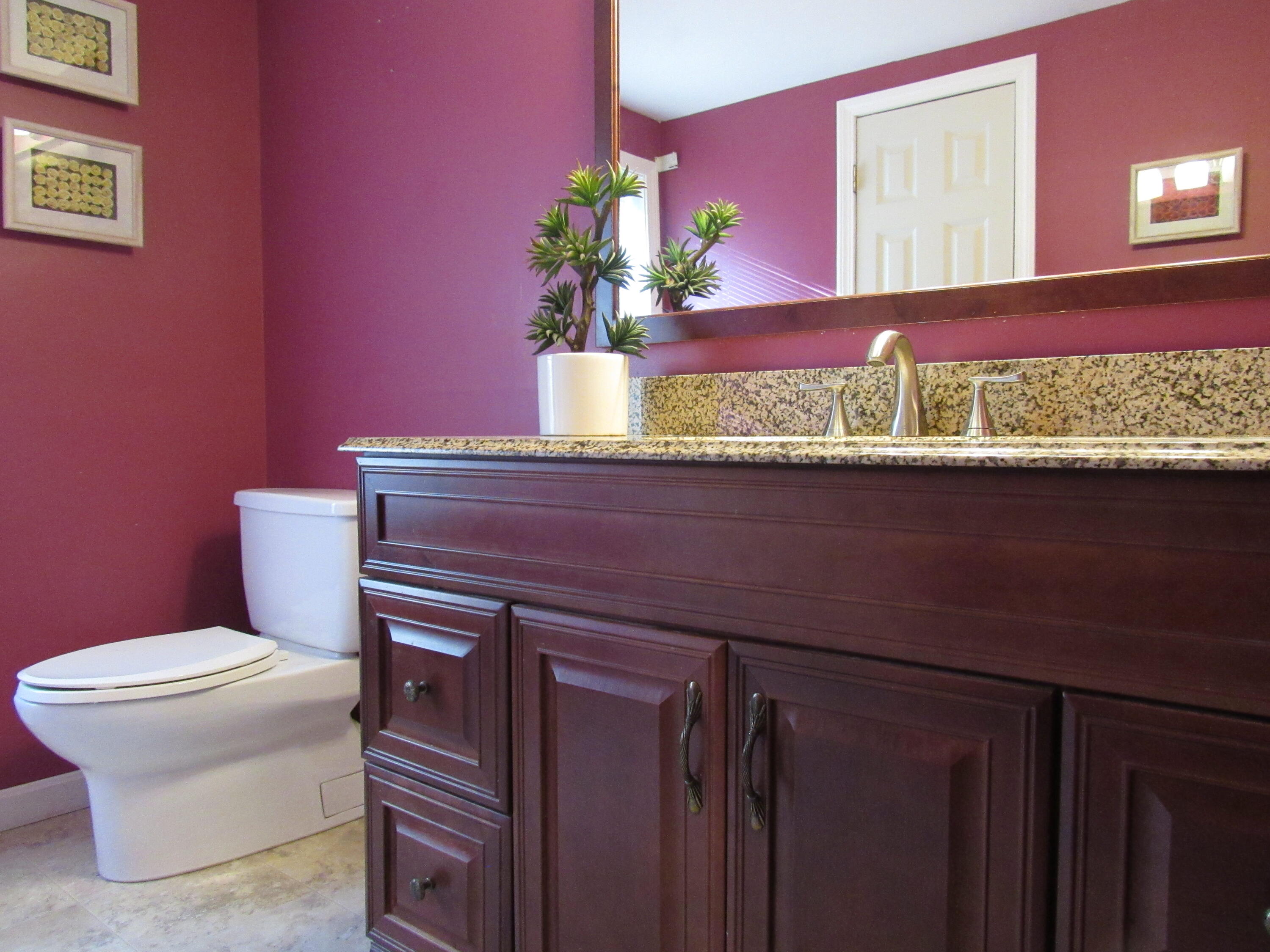 249 Ames Way Centerville, MA 02632 - Photo 27 of 41 a view of a living room with a sink and a potted plant