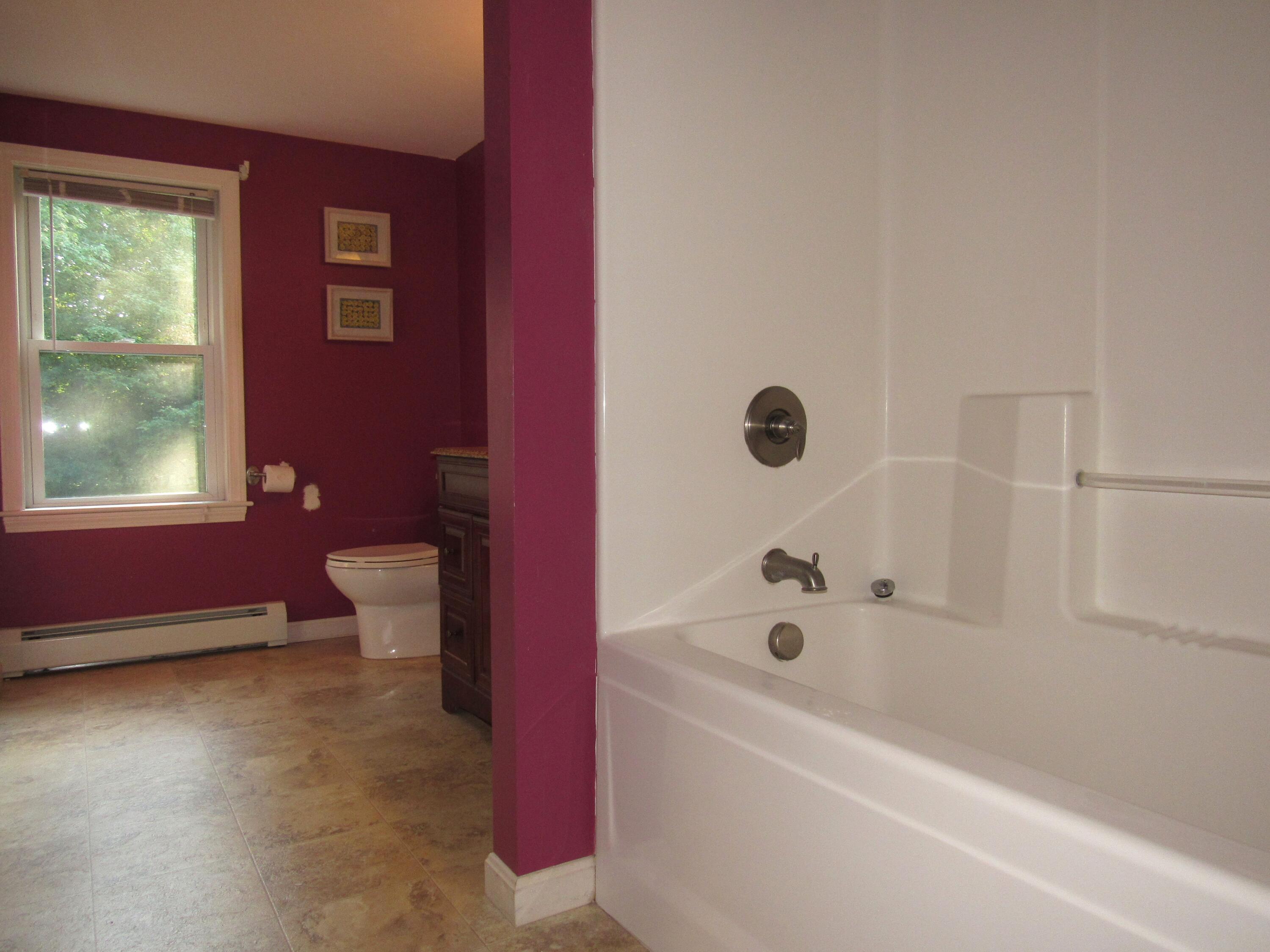 249 Ames Way Centerville, MA 02632 - Photo 28 of 41 a bathroom with a granite countertop tub a sink and a large mirror
