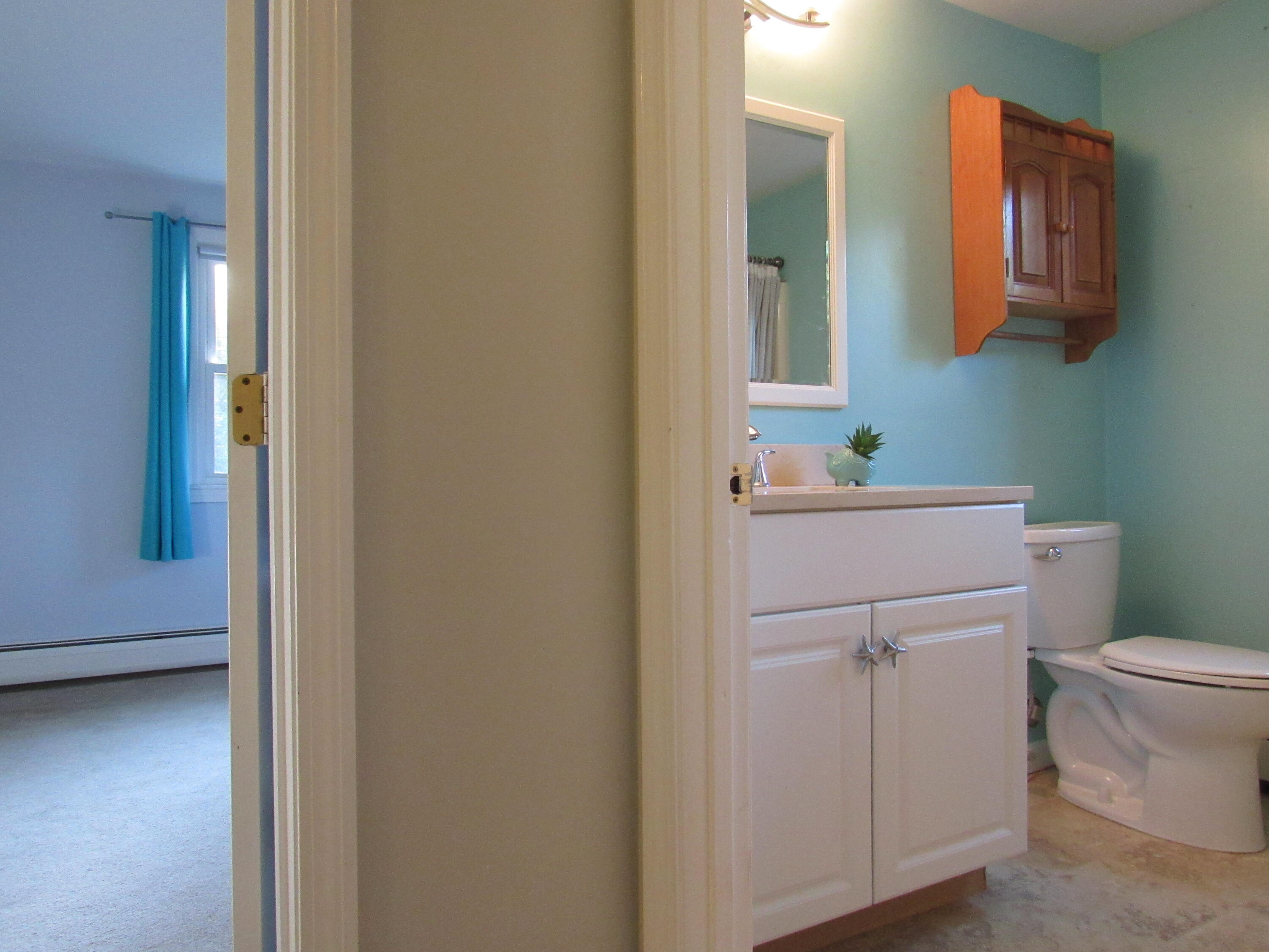 249 Ames Way Centerville, MA 02632 - Photo 35 of 41 a bathroom with a sink toilet and mirror