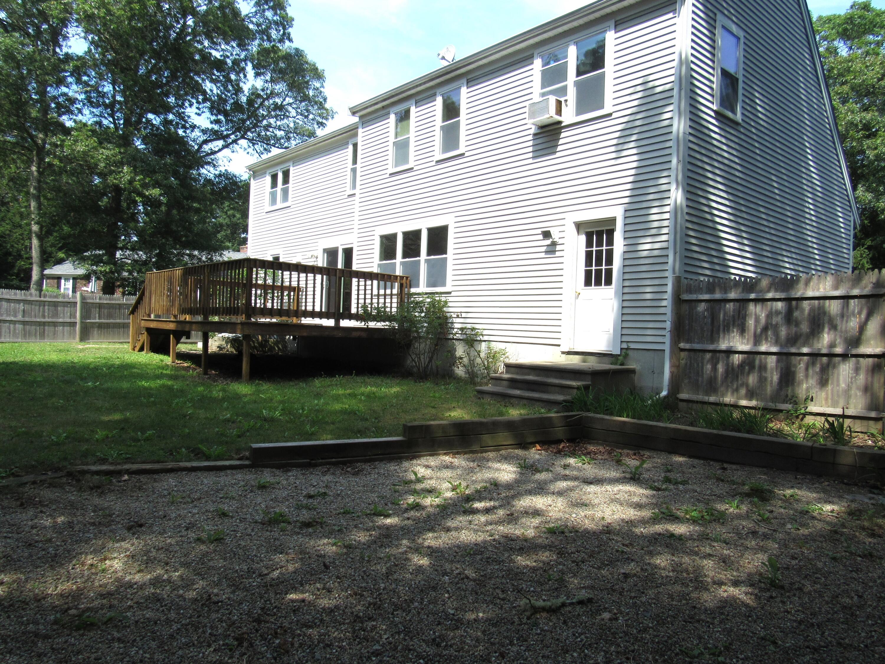 249 Ames Way Centerville, MA 02632 - Photo 6 of 41 a view of a house with backyard and sitting area