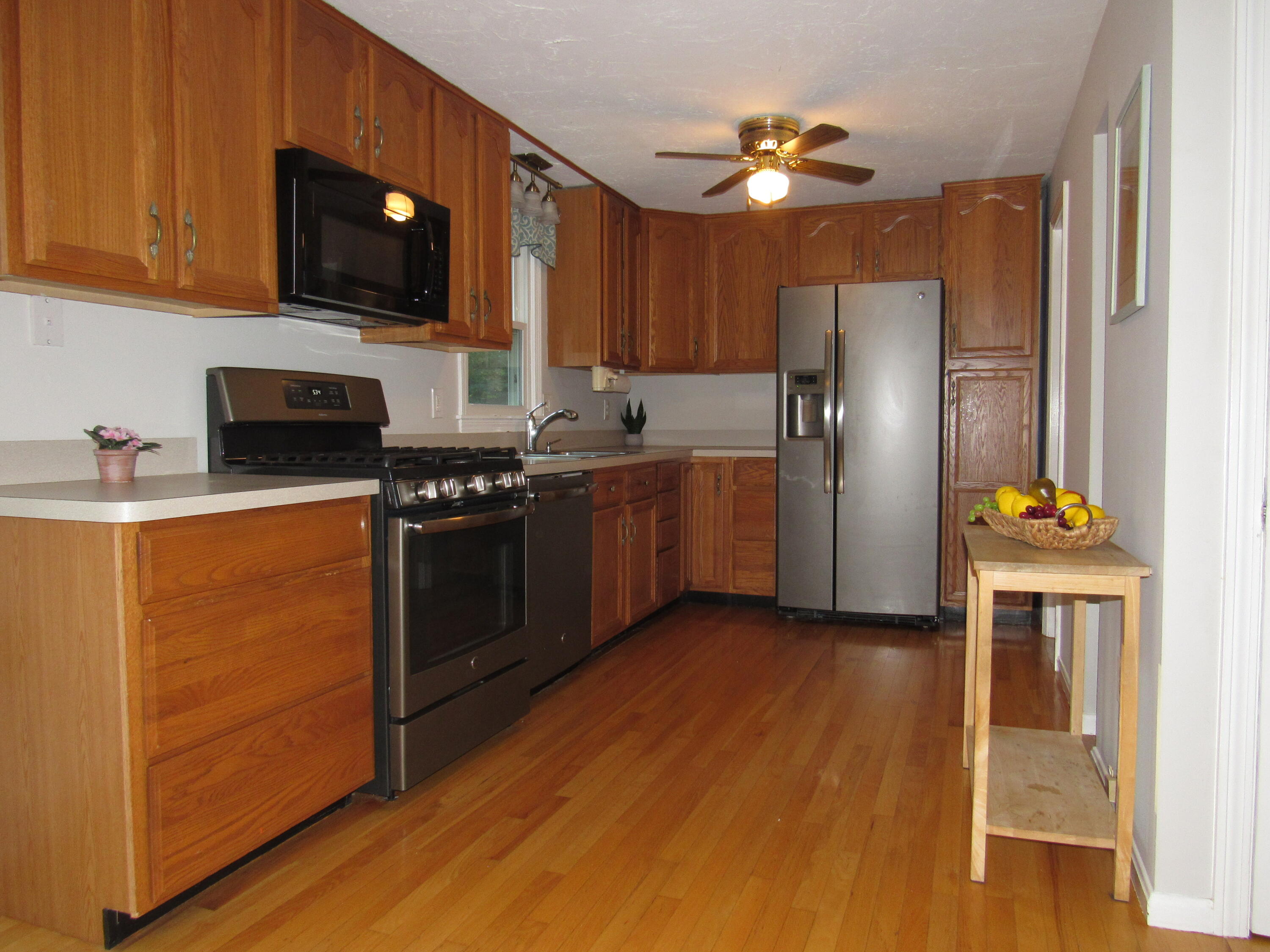 249 Ames Way Centerville, MA 02632 - Photo 10 of 41 a kitchen with stainless steel appliances a stove a refrigerator and a sink