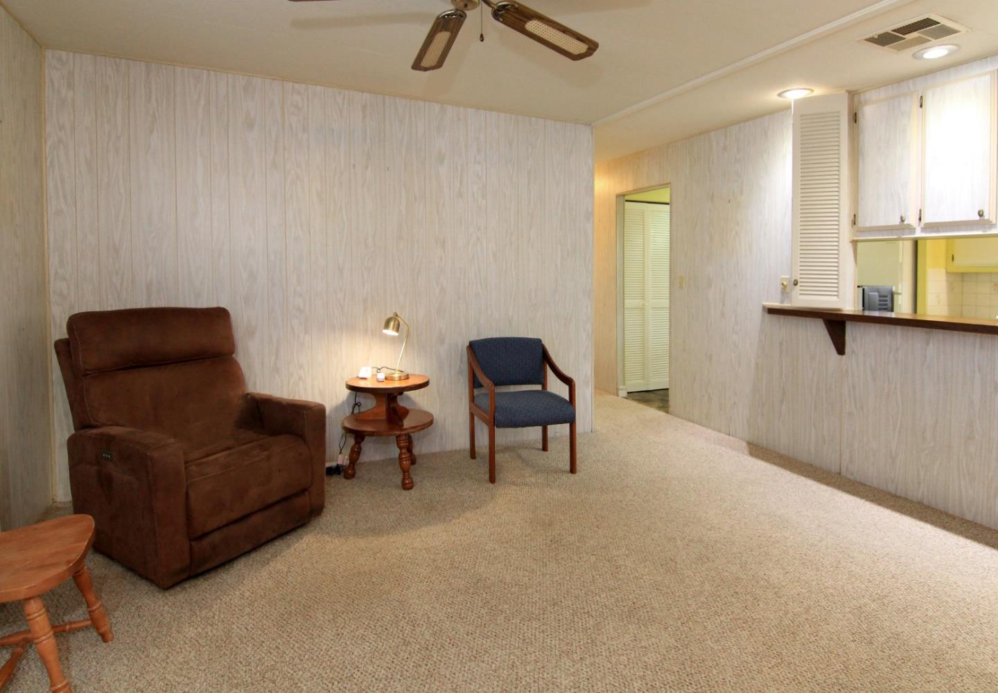 4425 Clares Street, Unit 3 Capitola, CA 95010 - Photo 13 of 23 a living room with furniture and a lamp