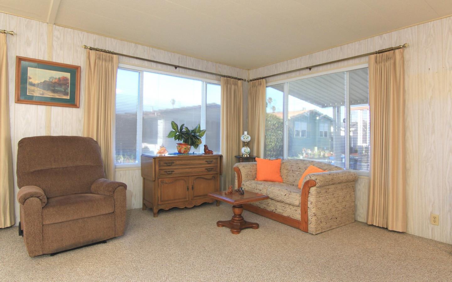4425 Clares Street, Unit 3 Capitola, CA 95010 - Photo 6 of 23 a living room with furniture and a large window