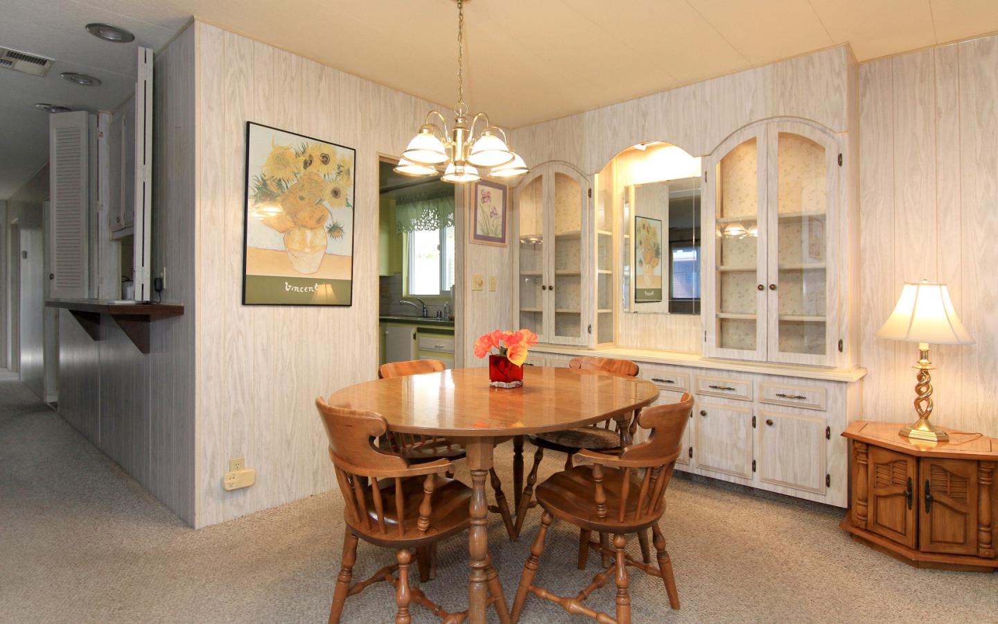 4425 Clares Street, Unit 3 Capitola, CA 95010 - Photo 8 of 23 a dining room with furniture and chandelier