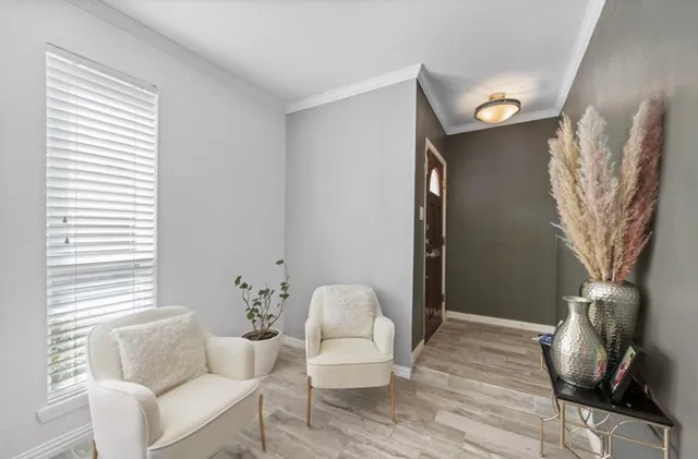 a living room with furniture and a window