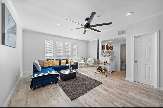 a living room with furniture and a window