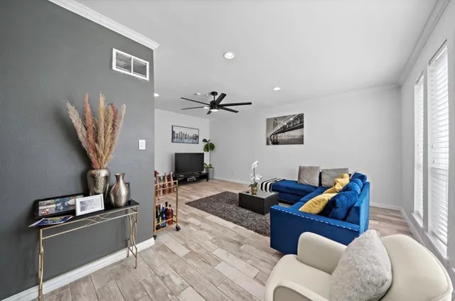 a living room with furniture and a window
