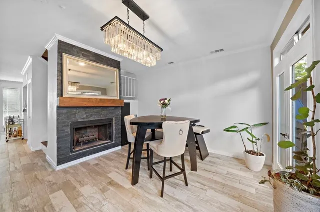 a view of a livingroom with furniture window and wooden floor