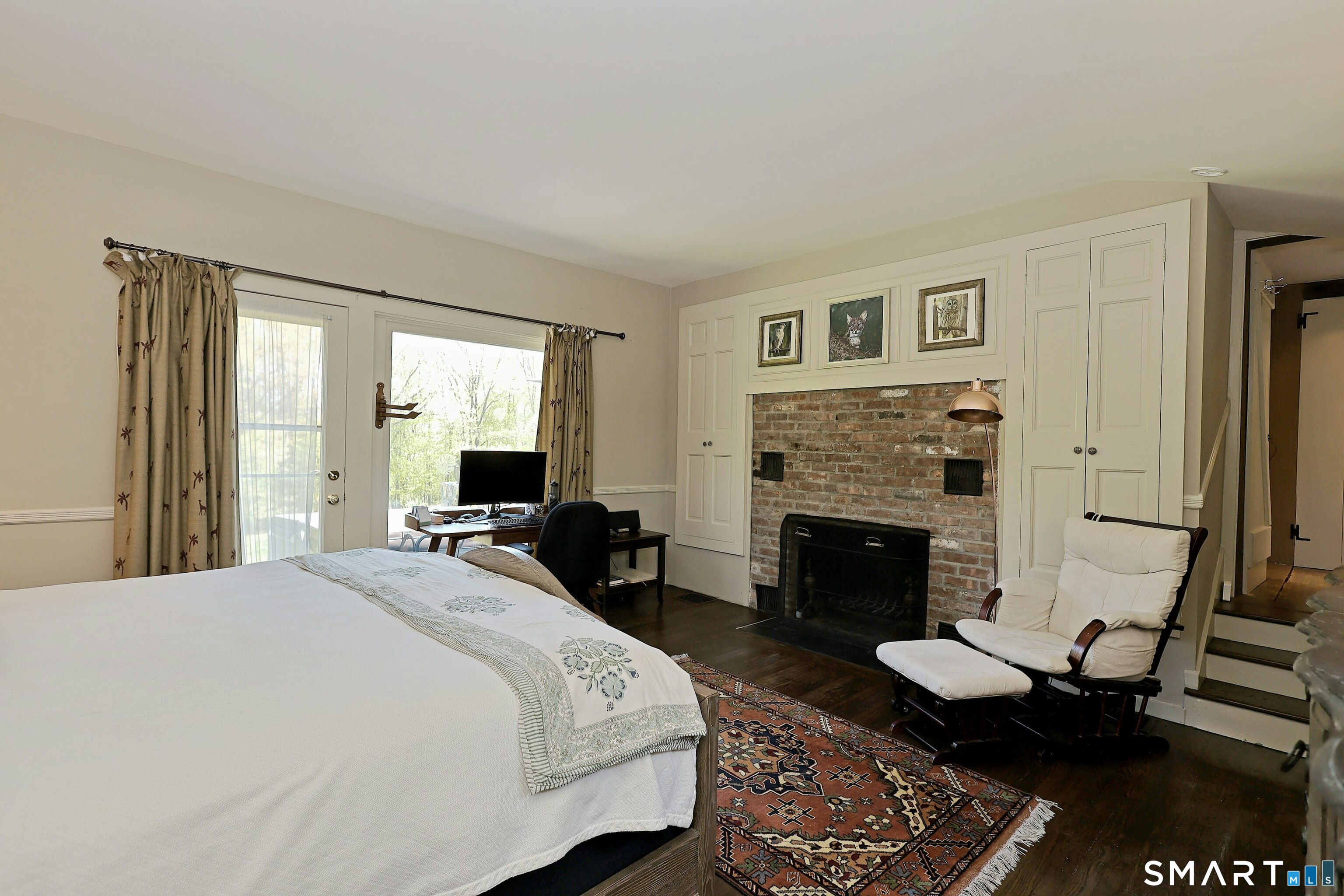 68 Bloomer Road Ridgefield, CT 06877 - Photo 19 of 40 a bedroom with a bed and a fireplace