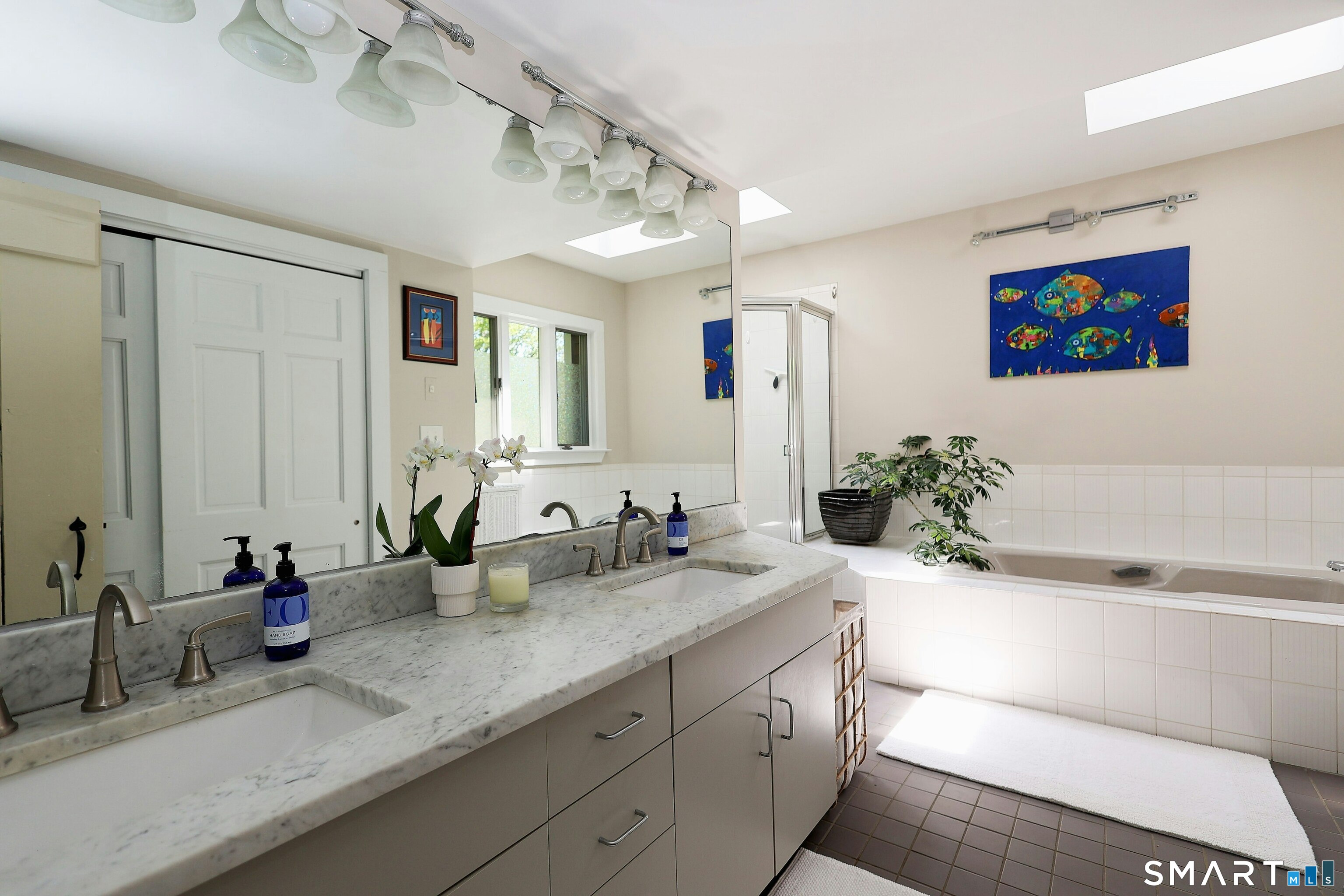 68 Bloomer Road Ridgefield, CT 06877 - Photo 22 of 40 a bathroom with a double vanity sink and a mirror