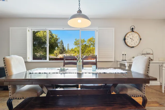 a dining room with furniture and window
