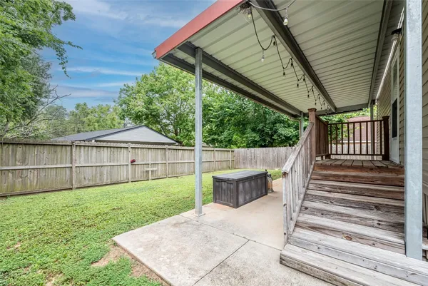 a view of backyard with green space