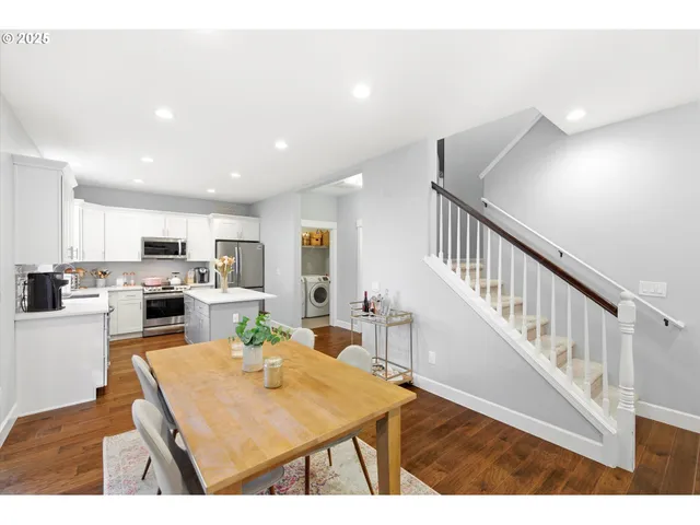 a living room with lots of counter space and kitchen view