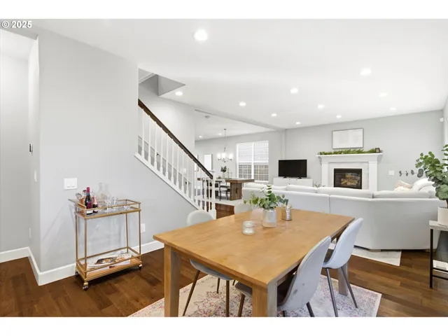 a view of a dining room with furniture and a kitchen