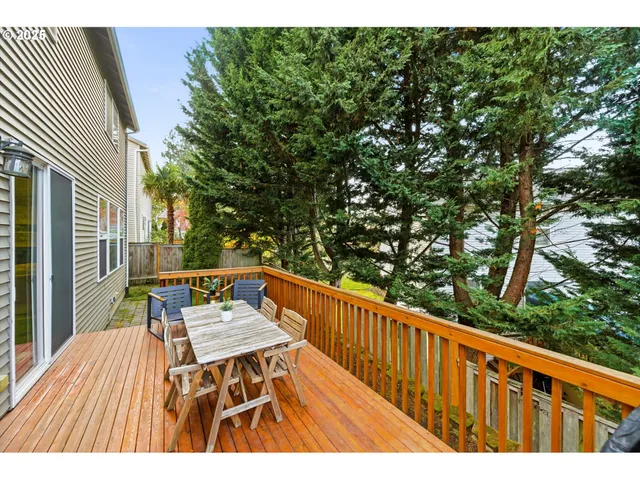 a balcony with wooden floor and outdoor space