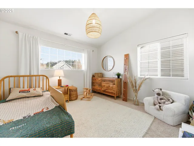 a bedroom with furniture and a window