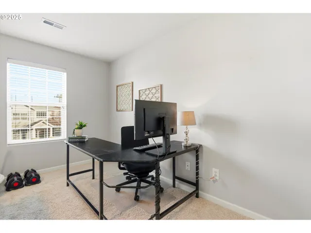 a workspace with furniture and a window