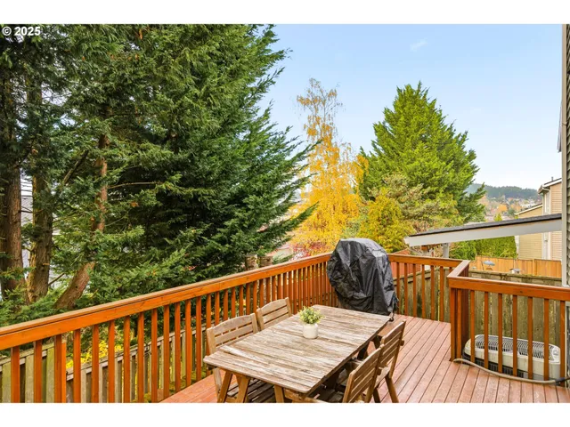a view of balcony with wooden floor and fence