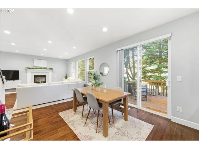 a dining room with furniture and wooden floor