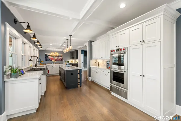 a kitchen with a table and chairs in it