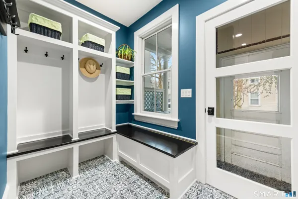 a bed room with a bed and a large window