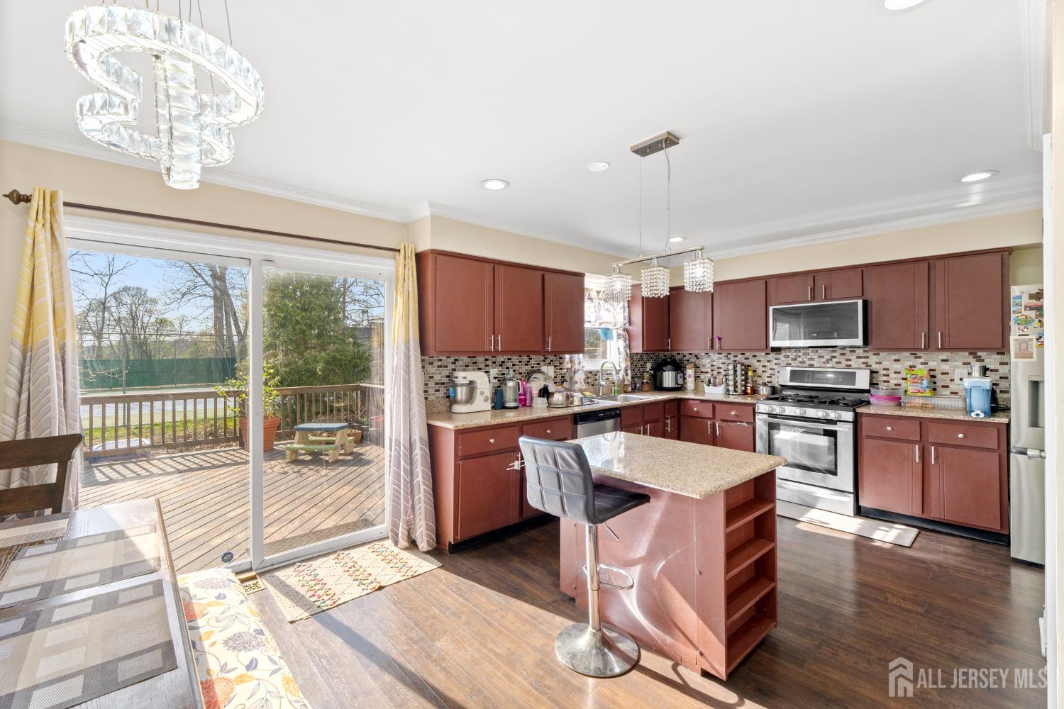 114 Pendleton Place Old Bridge, NJ 08857 - Photo 14 of 49 a large kitchen with kitchen island a large window cabinets and stainless steel appliances