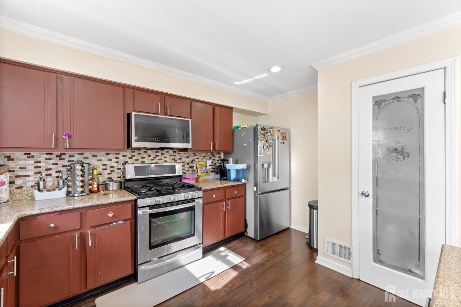 114 Pendleton Place Old Bridge, NJ 08857 - Photo 20 of 49 a kitchen with stainless steel appliances a stove a sink and a refrigerator