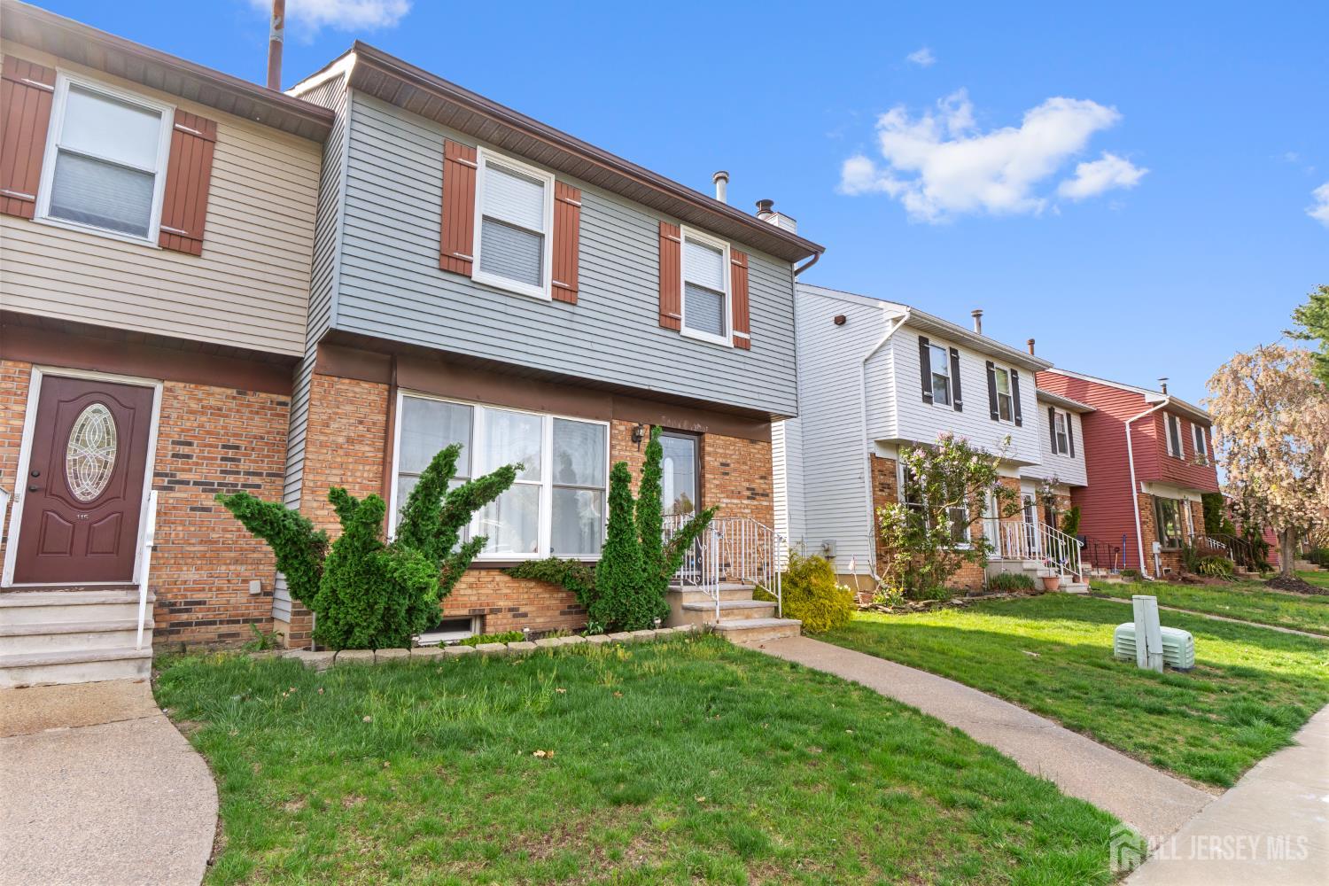 114 Pendleton Place Old Bridge, NJ 08857 - Photo 2 of 49 a front view of a house with garden