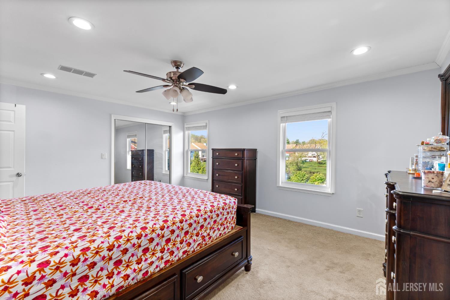 114 Pendleton Place Old Bridge, NJ 08857 - Photo 28 of 49 a bedroom with a bed and a chandelier