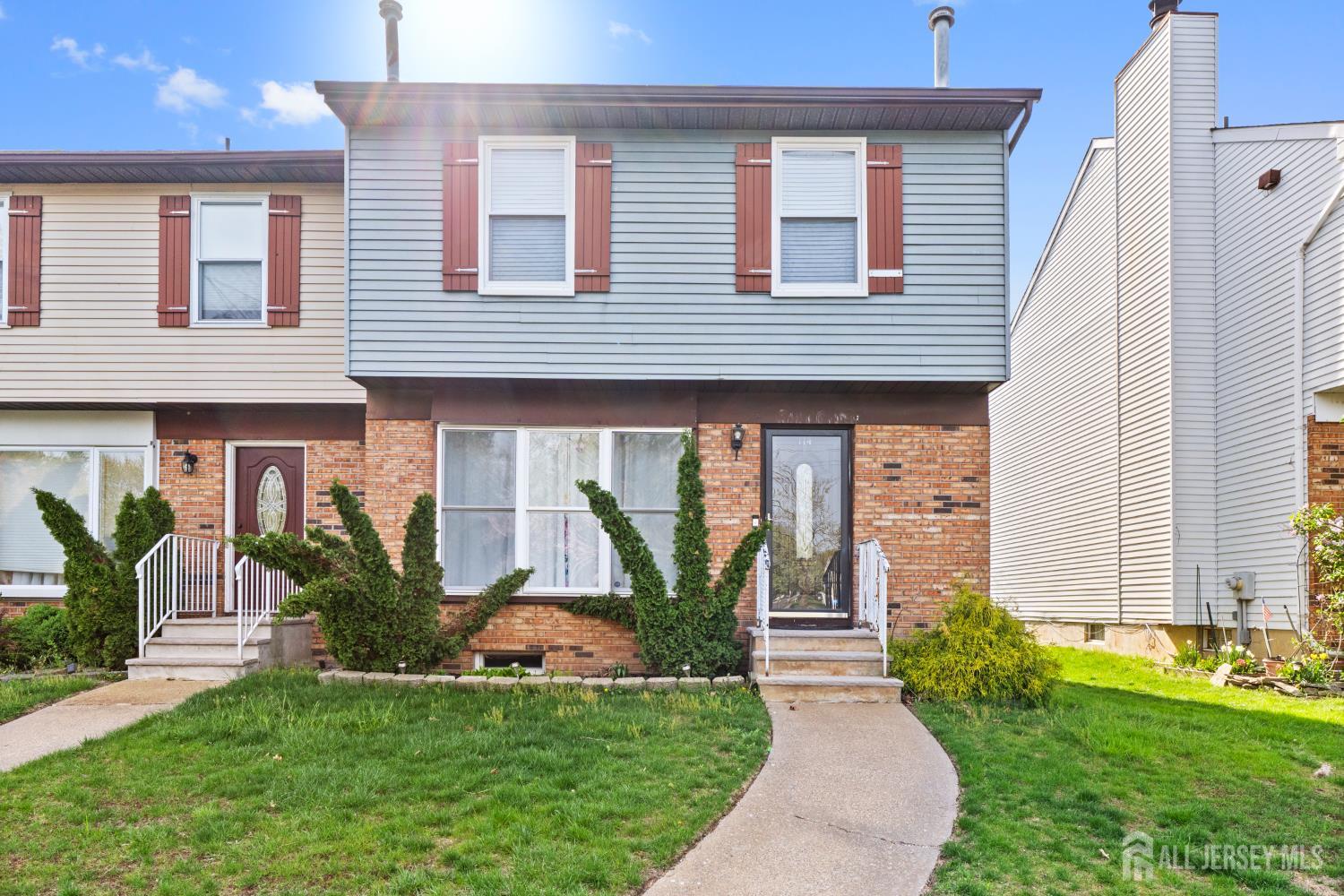 114 Pendleton Place Old Bridge, NJ 08857 - Photo 3 of 49 a front view of a house with garden