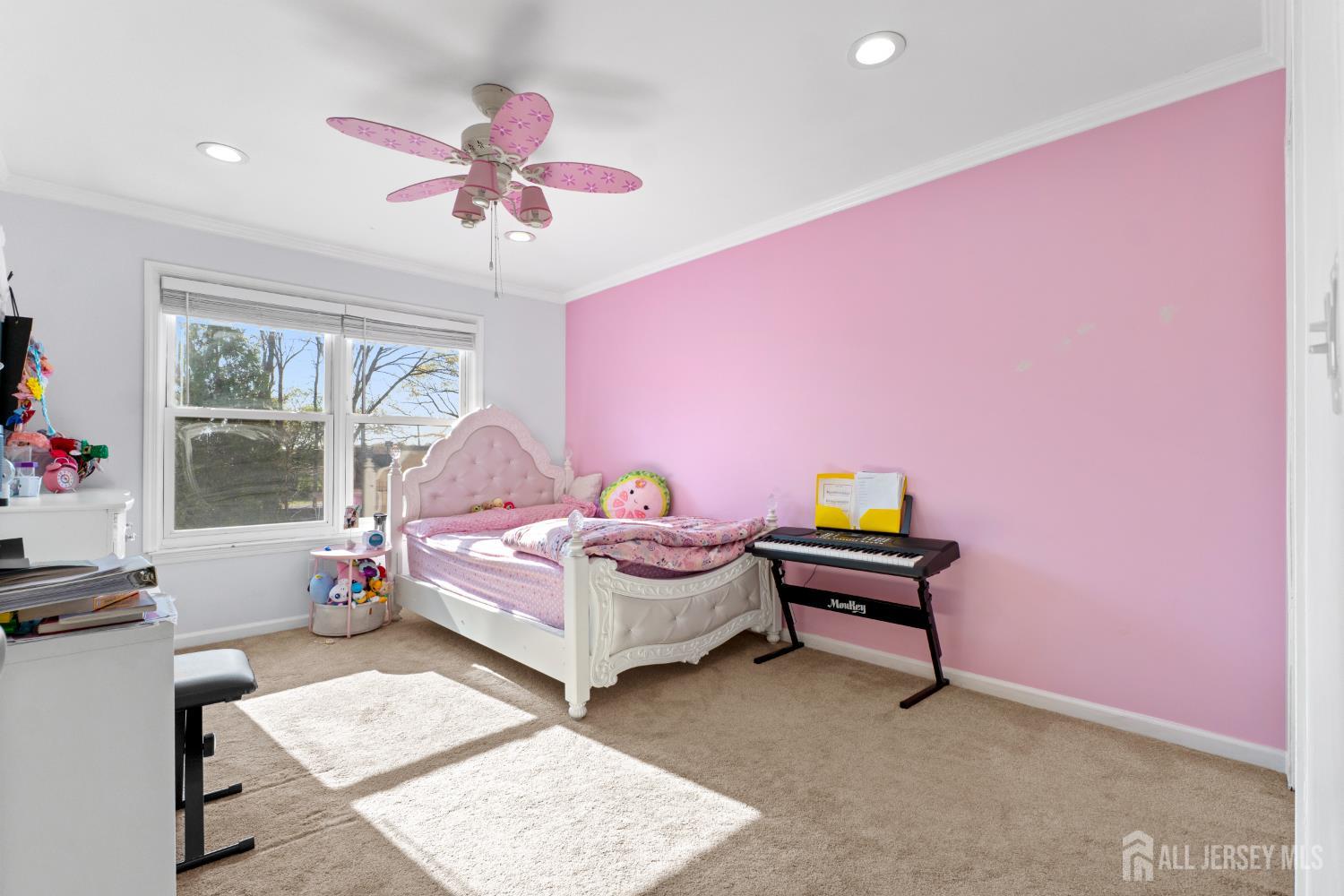 114 Pendleton Place Old Bridge, NJ 08857 - Photo 35 of 49 a bedroom with a bed and a chandelier