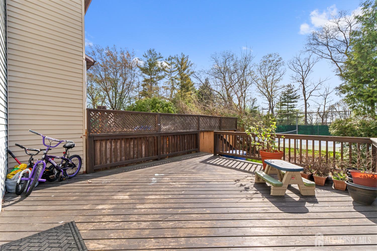 114 Pendleton Place Old Bridge, NJ 08857 - Photo 38 of 49 a view of a deck with wooden floor and fence