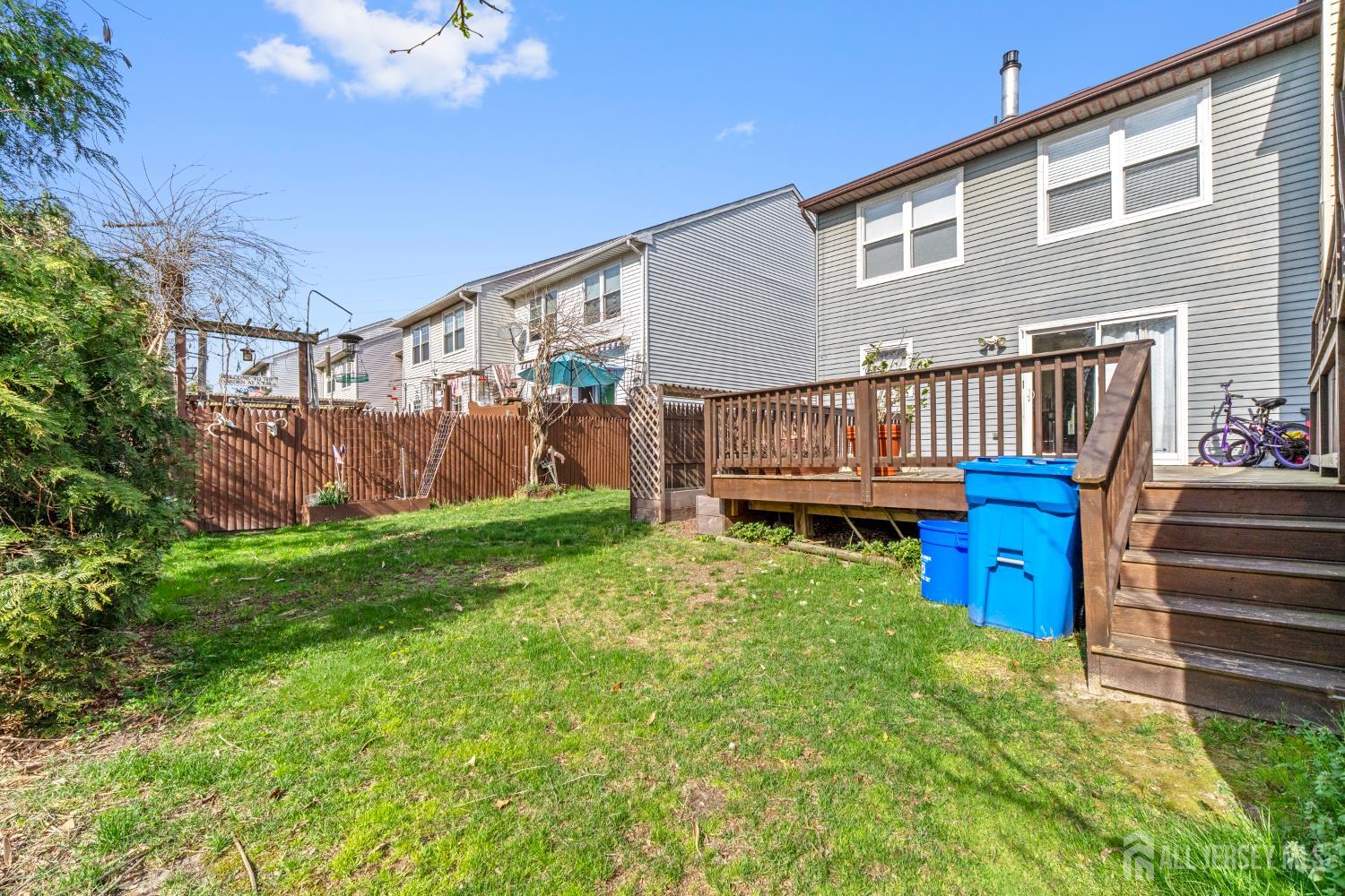 114 Pendleton Place Old Bridge, NJ 08857 - Photo 39 of 49 a view of backyard with deck and wooden fence