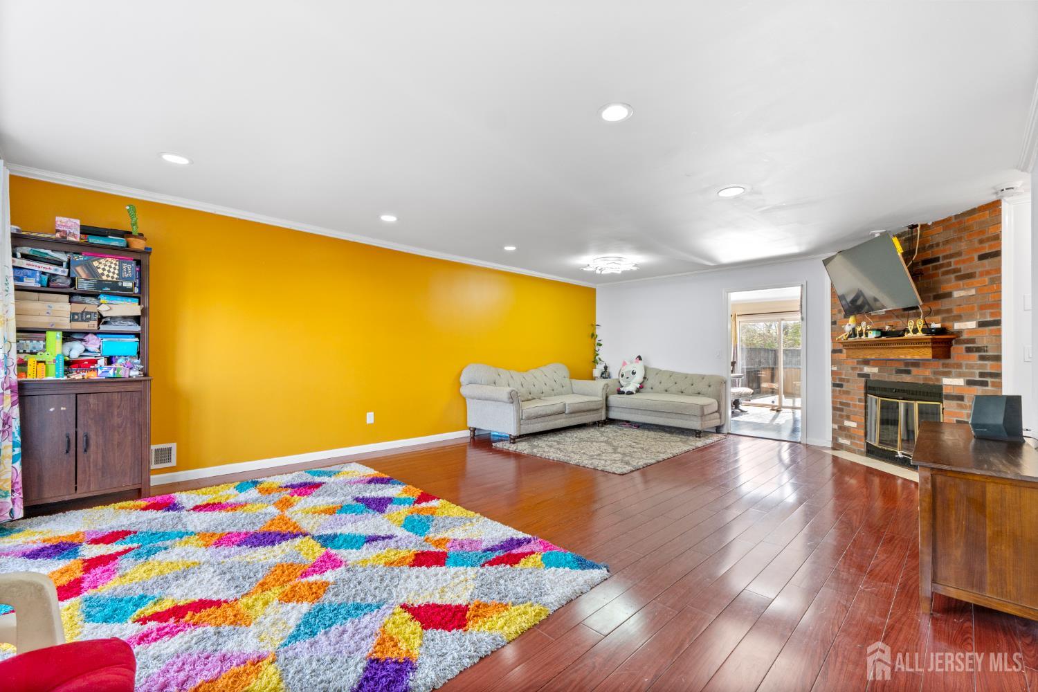 114 Pendleton Place Old Bridge, NJ 08857 - Photo 6 of 49 a bedroom with a bed and a flat screen tv