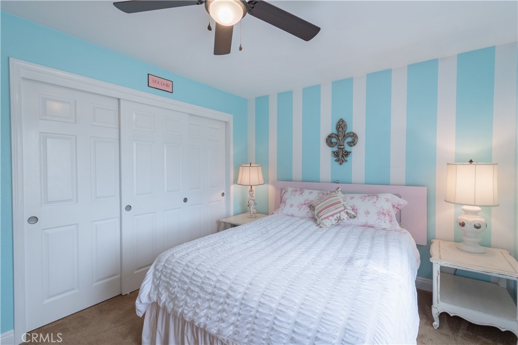 2660 Vineyard Circle Paso Robles, CA 93446 - Photo 17 of 39 a bedroom with a bed and a chandelier