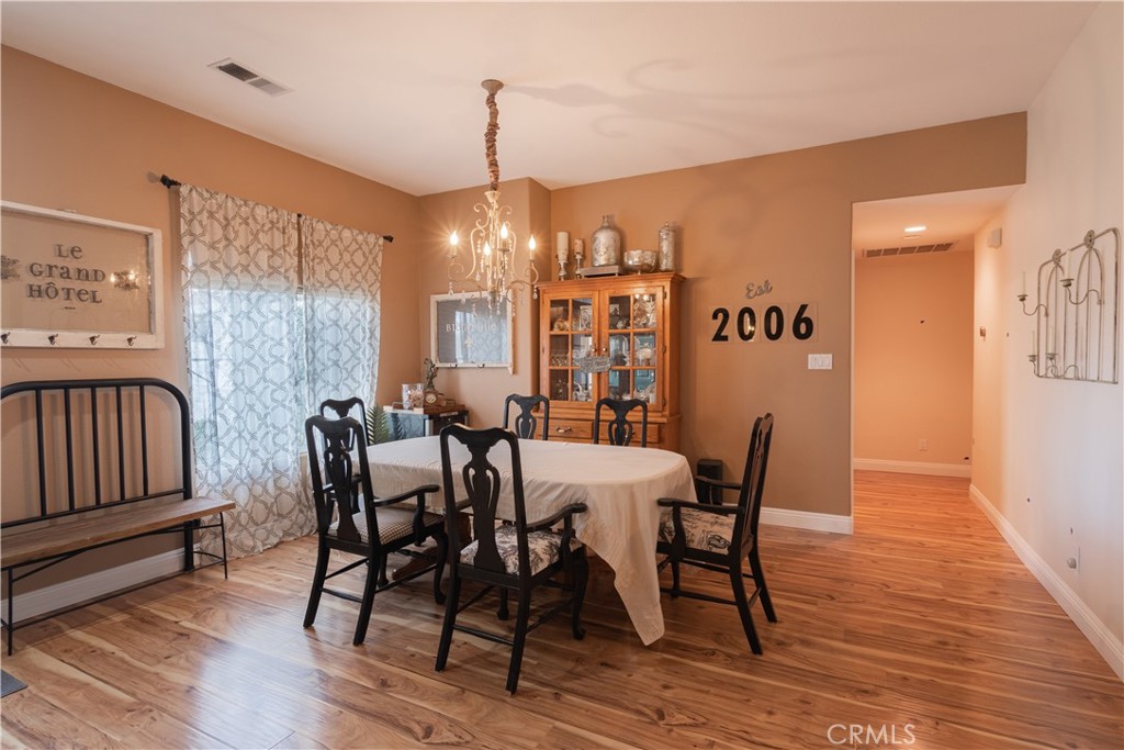 2660 Vineyard Circle Paso Robles, CA 93446 - Photo 4 of 39 a view of a dining room with furniture window and wooden floor