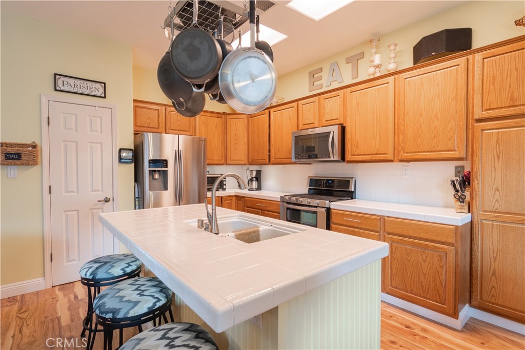 2660 Vineyard Circle Paso Robles, CA 93446 - Photo 10 of 39 a kitchen with stainless steel appliances granite countertop a sink a stove and refrigerator