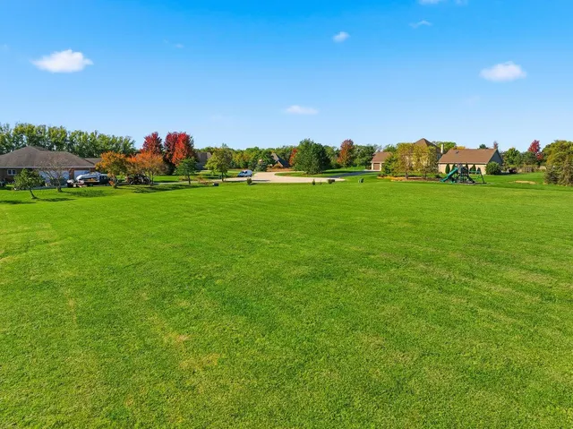 a view of a town with couple of large trees