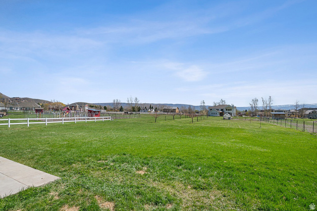 550 Pine Canyon Road Midway, UT 84049 - Photo 36 of 44 Expansive green lawn with a white fence border