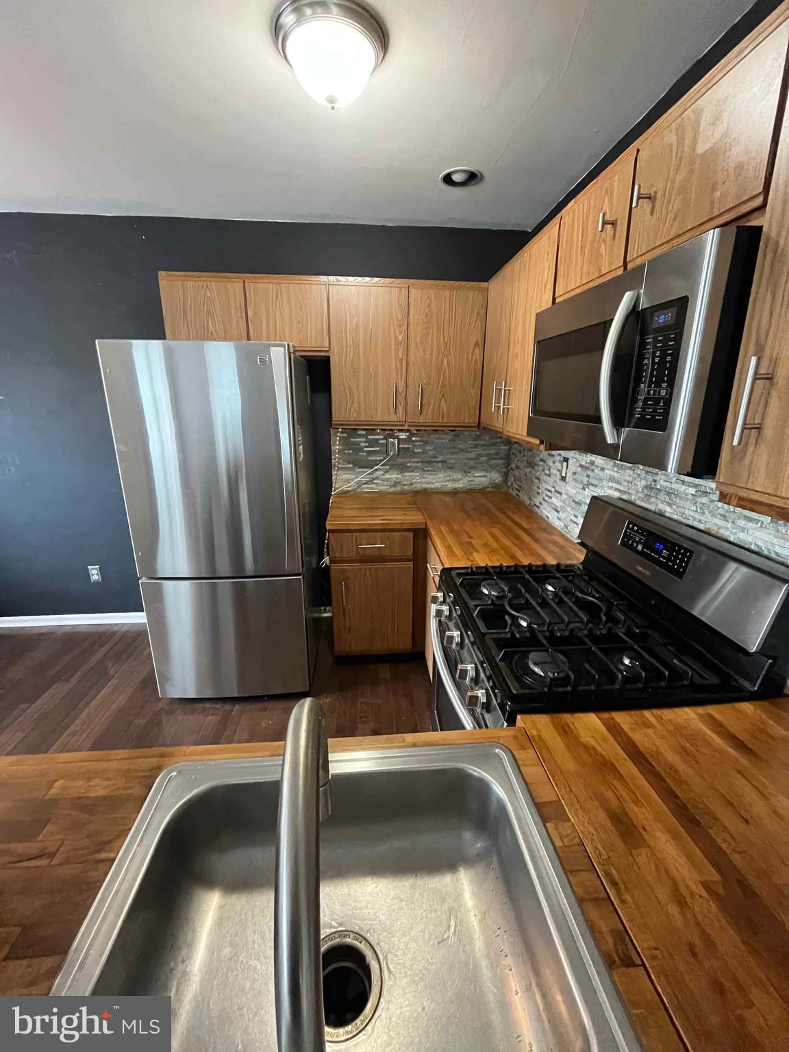 500 Crystal, Unit 19A Norristown, PA 19403 - Photo 11 of 11 a kitchen with stainless steel appliances granite countertop a sink and a stove