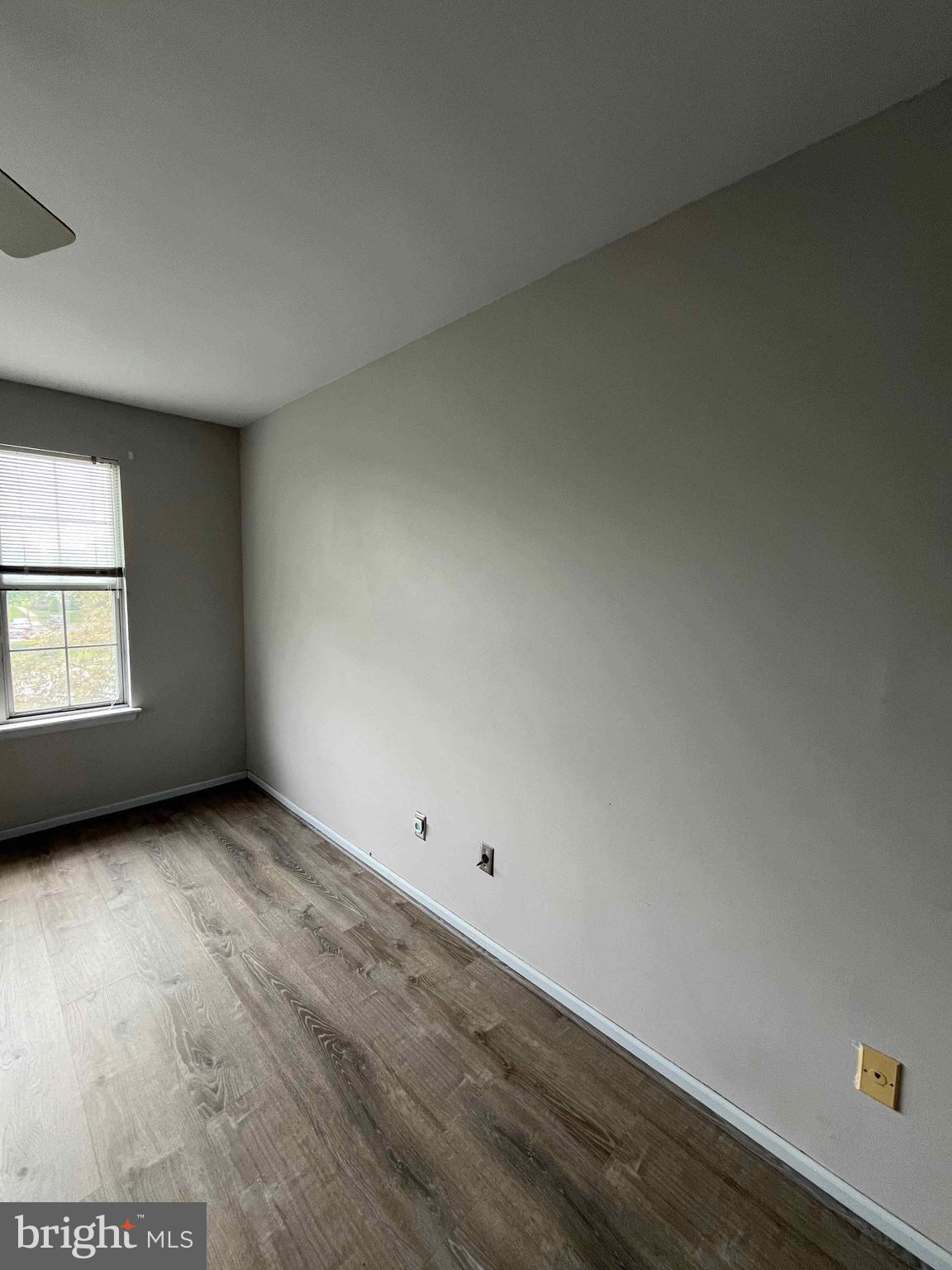 500 Crystal, Unit 19A Norristown, PA 19403 - Photo 8 of 11 an empty room with wooden floor and windows