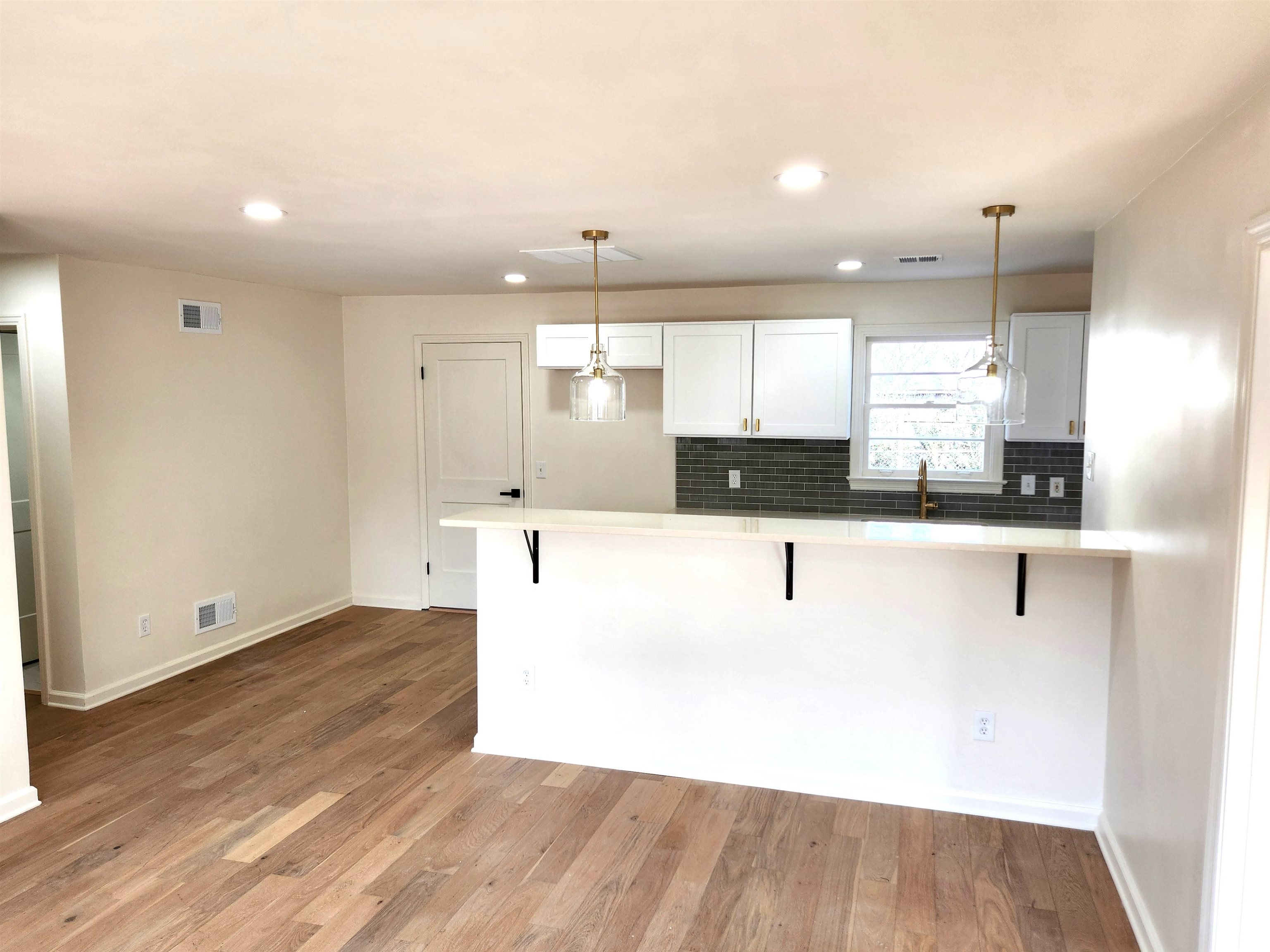 5030 Dee Road Memphis, TN 38117 - Photo 4 of 19 a large white kitchen with a refrigerator a sink dishwasher and a stove