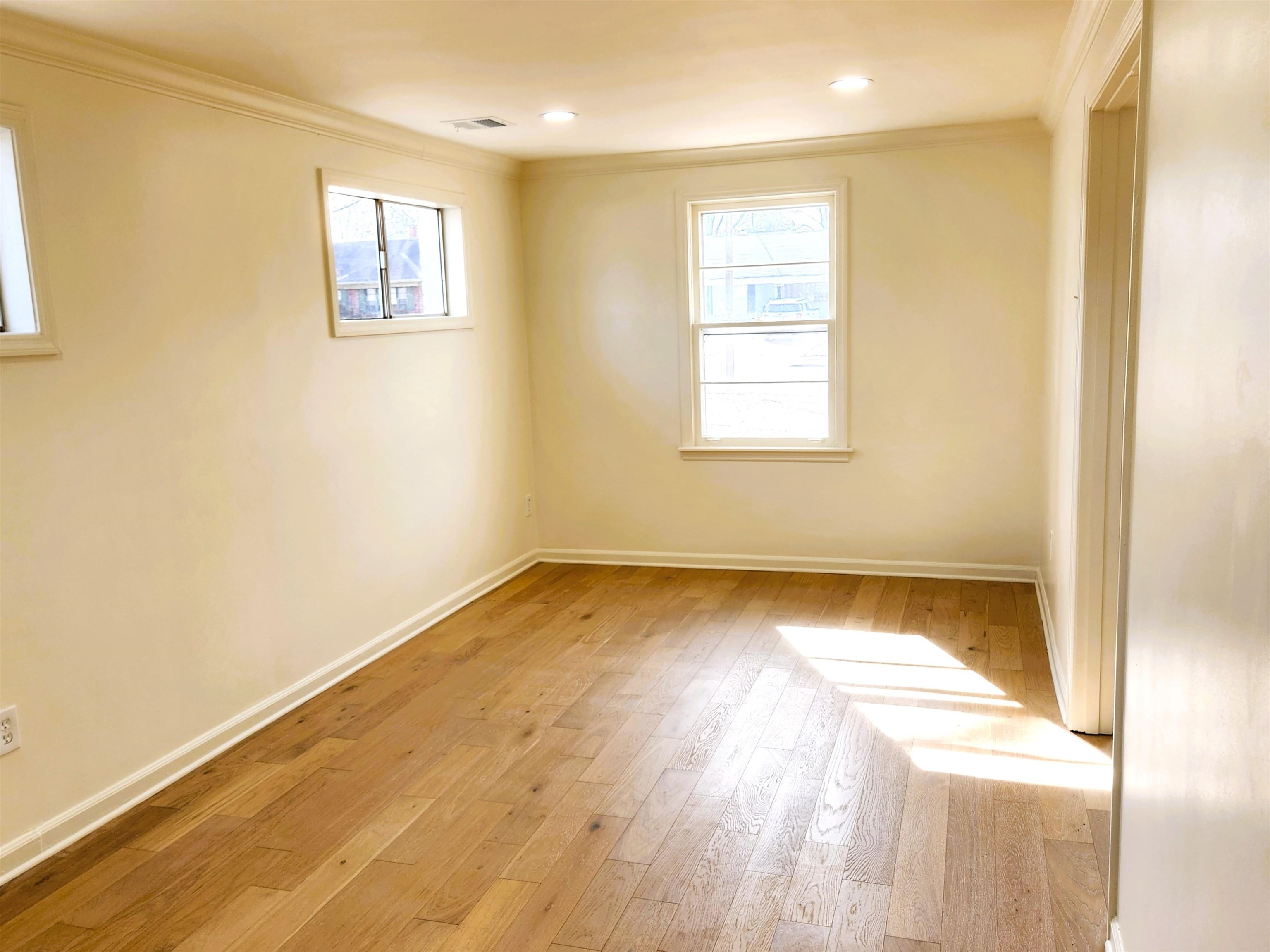 5030 Dee Road Memphis, TN 38117 - Photo 6 of 19 a view of a room with wooden floor and window