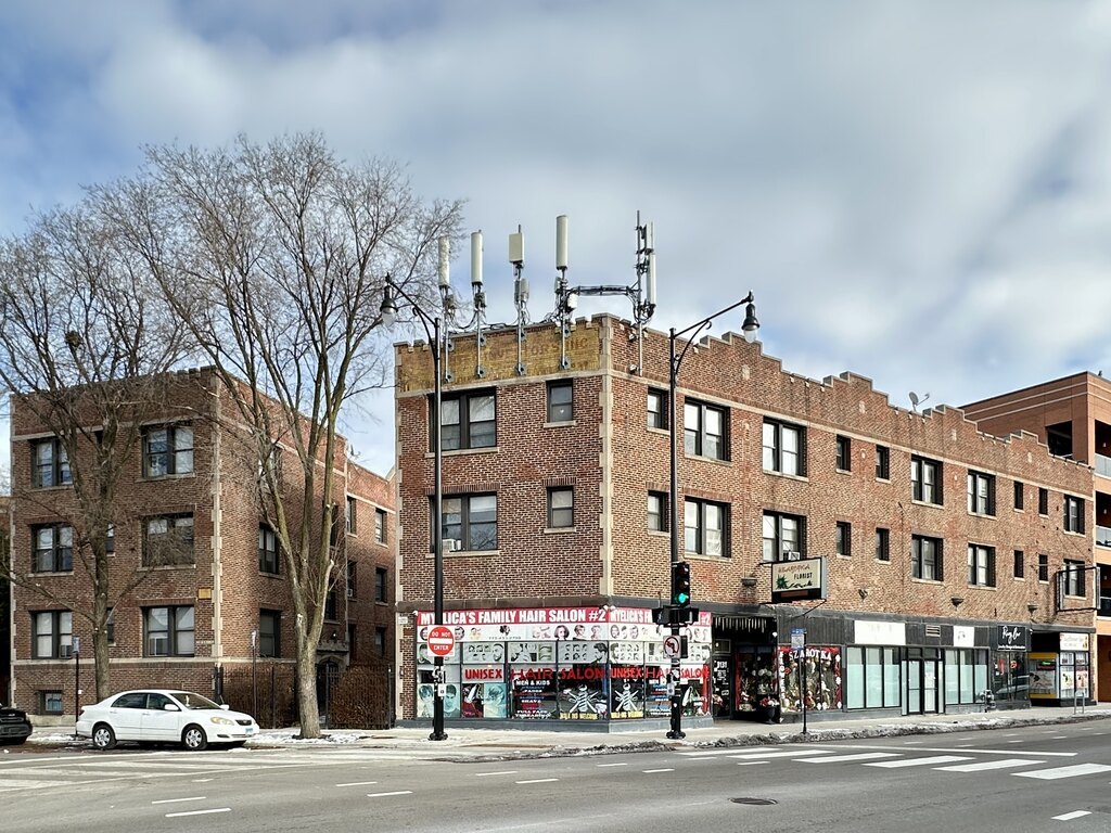 a city street lined with buildings and traffic signal
